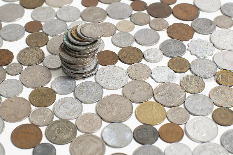 Closeup of a lot of coins money from different countries of the world.